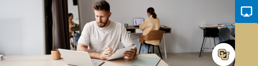 Learning with an open computer screen and an open notebook in order to master CISSP