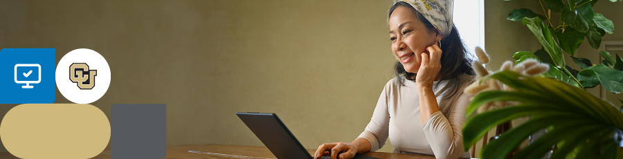Looking happy while reading from her computer screen and thinking about Elevate Your Cybersecurity Career With ISC2 Certifications