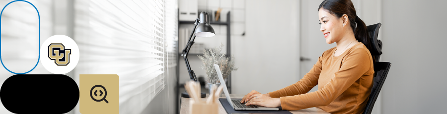 Person working on a laptop at a desk, with Colorado University and email icons nearby