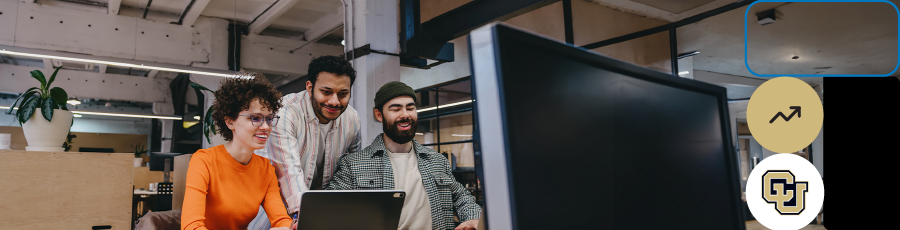 Three individuals working at computers in a modern office, highlighting the importance of cybersecurity